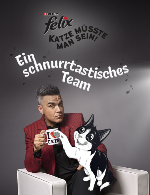 Felix und Robbie zusammen. Robbie hält eine Tasse mit "I love CATS" Aufschrift